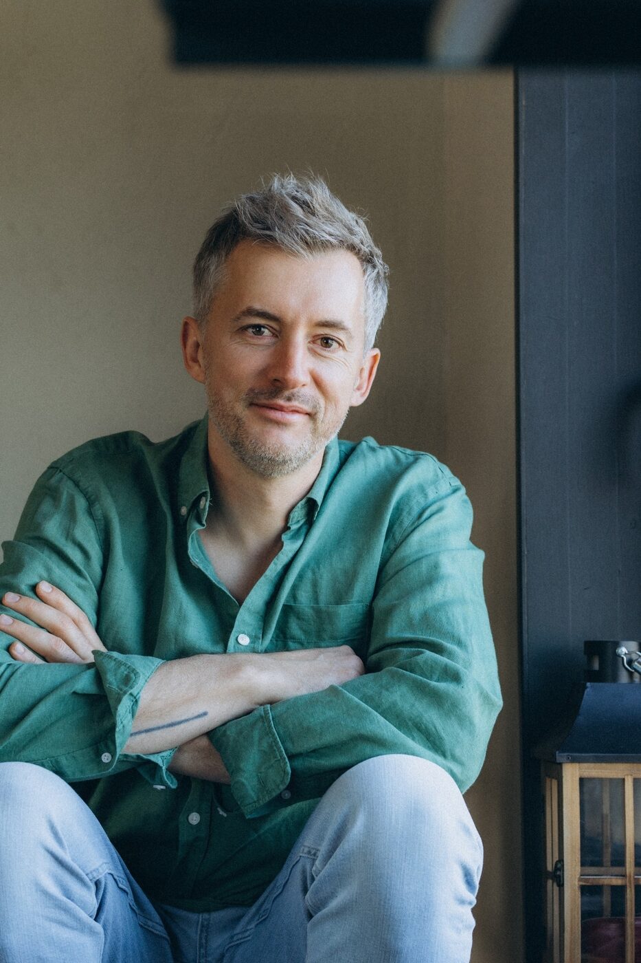Seated portrait in a green linen shirt
