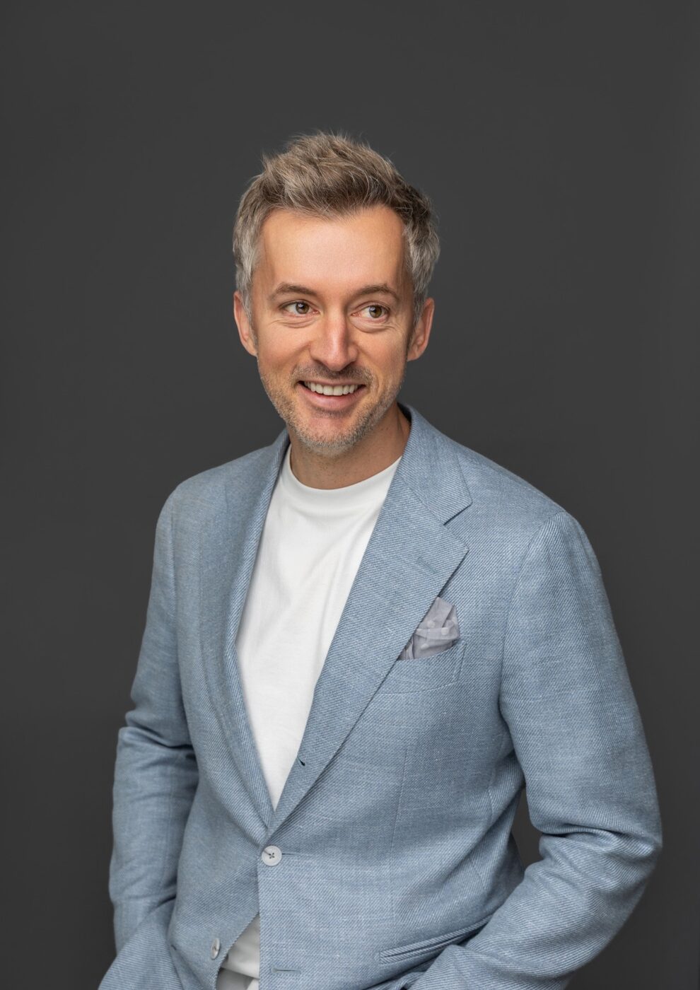 Studio portrait in a light blazer